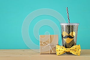 Image of black cup with golden heart. Father`s day concept.