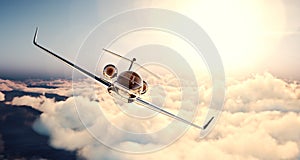 Image of black luxury generic design private jet flying in blue sky at sunset. Huge white clouds and sun background