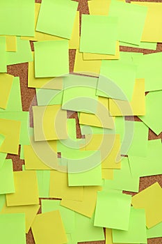 Image of blank colorful sticky notes on cork pinboard