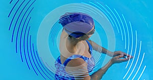 Image of blue line spiral rotating over woman swimming in pool