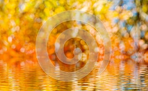 image of blurred water on abstract autumn background