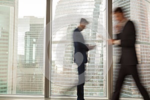 Busy businessman hurrying on business in office