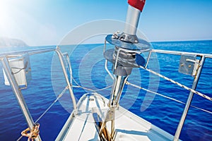 Image of the bow of a cruising sailing ship with roller furling gear.