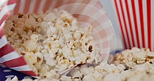 Image of box of popcorn over red and white box