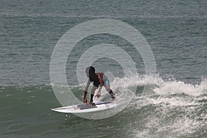 The boy learn surfing in Lagos popular beach, Tarkwa bay, Lagos Nigeria