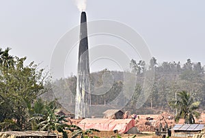 This is an image of bricks industries chimney and smokes