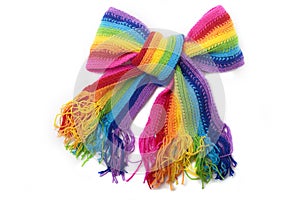 The image of a bright rainbow knitted scarf