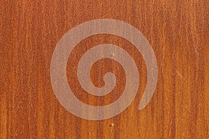 The image is of a brown surface with a lot of texture