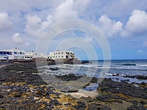 Image of buildings on the coast and the sea in Arrieta. Lanzarote, Spain photo