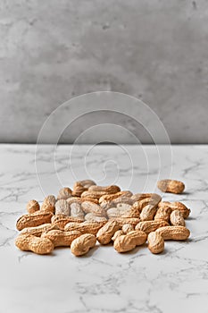 Image of bunch of peanuts on a marble table