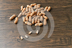 Image of bunch of peanuts on a wooden table