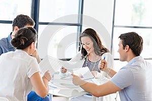 Image of business partners discussing documents and ideas