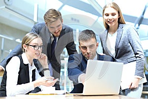 Image of business partners discussing documents and ideas at meeting