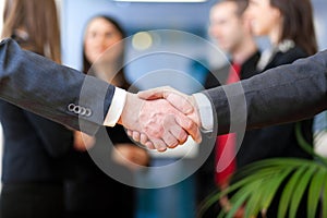 Image of business partners handshake on signing contract