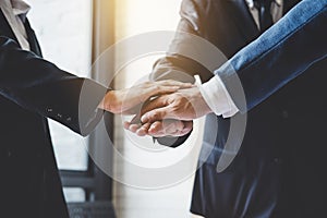 Image of business people joining and putting hands together during their meeting, connection and collaboration concept, Teamwork