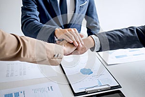 Image of business people joining and putting hands together during their meeting, connection and collaboration concept, Teamwork