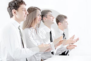 Image of a business team applauding in the sign of approval