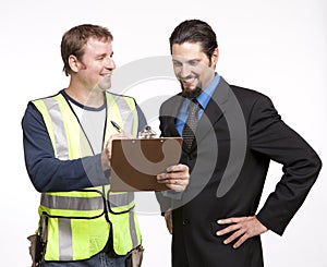 Image of a businessman and construction worker discussing report