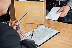 Image of businessman hand holding cardboard box and sending a re