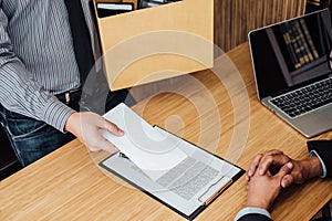 Image of businessman hand holding cardboard box and sending a re