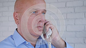 Businessman Make a Phone Call Using Office Landline