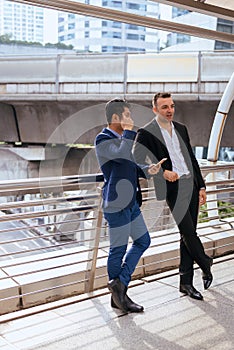 Image of businessman talking and consult while standing together