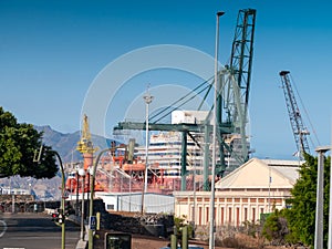 Image of cargo port terminal at ocean harbour with floating docks and hevy lifting crane photo