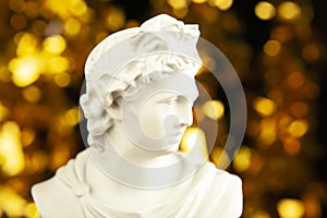 image of cesar statue gold bokeh