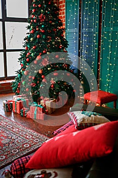 Image of chimney and decorated Christmas tree with gift.