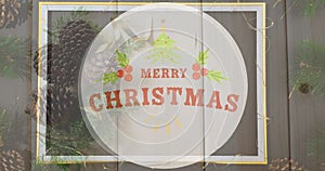 Image of christmas greetings text over christmas decorations