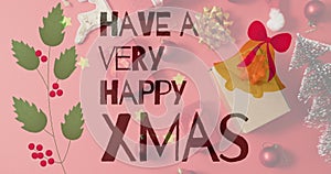 Image of christmas greetings text over christmas presents and decorations