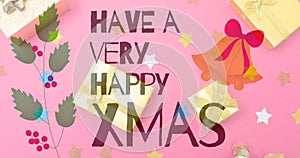 Image of christmas greetings text over christmas presents and decorations