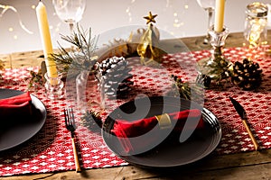 Image of christmas place setting with christmas decoration on wooden background