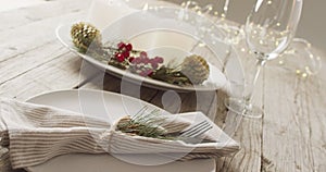 Image of christmas place setting with cutlery and candles on grey background