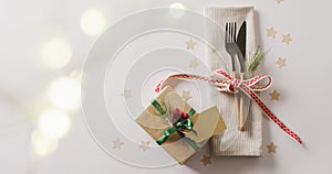Image of christmas place setting with cutlery and copy space on white background