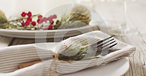 Image of christmas place setting with cutlery on grey background