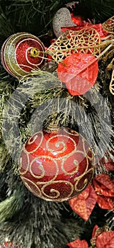 an image of Christmas tree accessorie or decoration with red colour