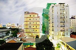 Image of cityscape at night. Urban buildings