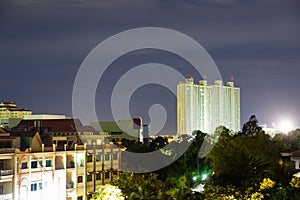 Image of cityscape at night. Urban buildings