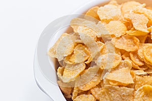 Image Close up Cornflakes cereal breakfast in white bowl on wh