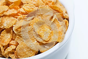 Image Close up Cornflakes cereal breakfast in white bowl on wh