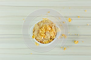Image Close up Cornflakes cereal breakfast in white bowl on woo