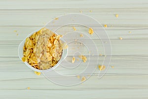 Image Close up Cornflakes cereal breakfast in white bowl on woo