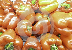 An image close-up a many pile is a sweet pepper bell the red color use for background