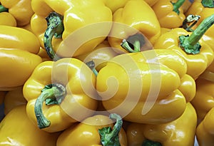 An image close-up a many pile is a sweet pepper bell the yellow color use for background