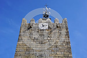 Medieval clock tower in Caminha, Portugal photo