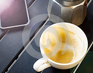 An image closeup flat lay or top view selected focus milk foam coffee in the mug empty has already been drink on desk in the cafe