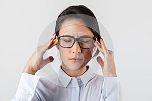 Image closeup of uptight secretary woman wearing eyeglasses standing in the office, isolated over white background