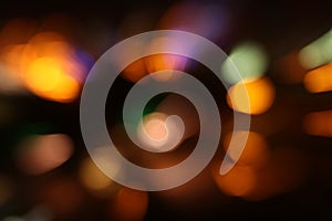 Image of colorful blurred defocused bokeh Lights. motion and nightlife concept