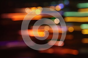 image of colorful blurred defocused bokeh Lights. motion and nightlife concept